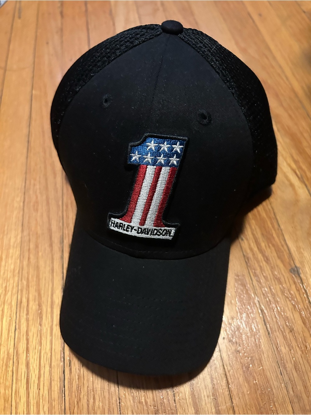 New Era Black Trucker Cap with Red, White & Blue Number Patch